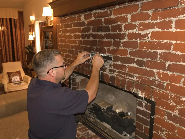 Mission Viejo Chimney Sweep expert fixing a fireplace in Mission Viejo, CA